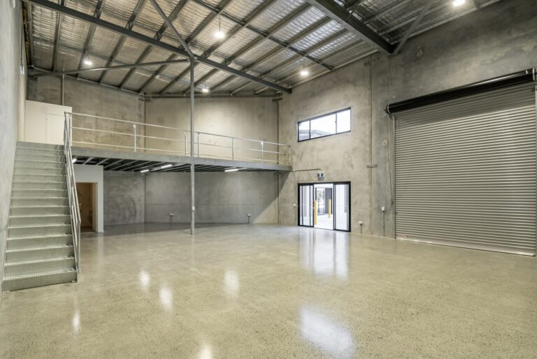 Large empty warehouse with high ceilings and mezzanine level in Mullumbimby NSW.